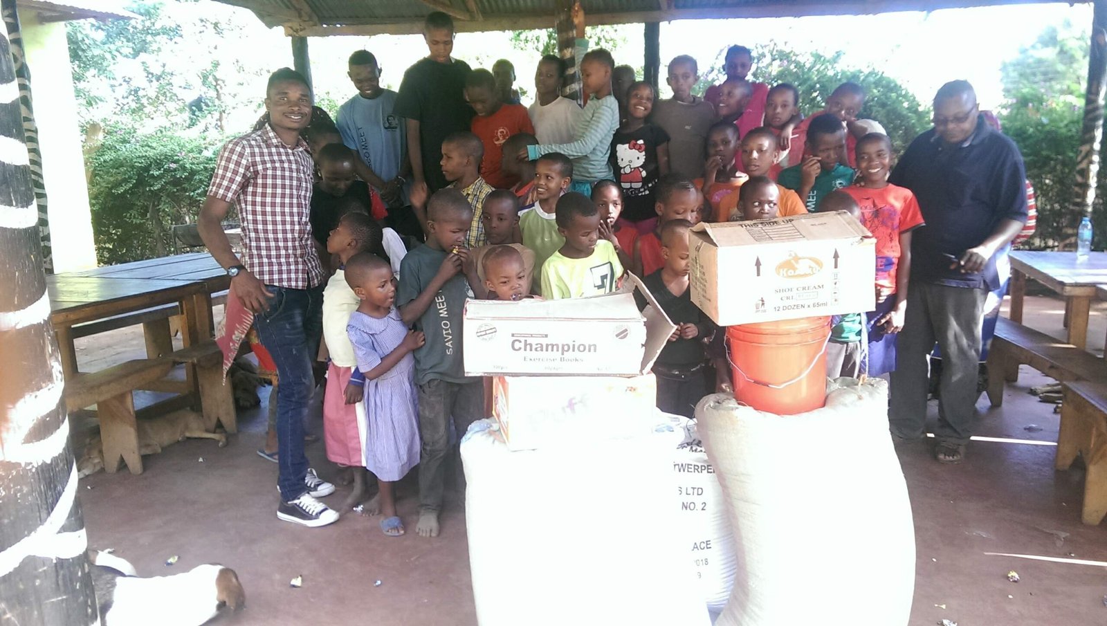 Mike Hardson at a community distribution with children