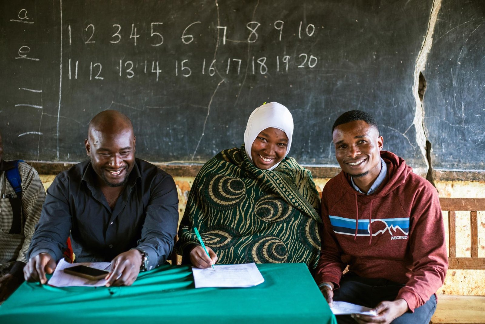 Teachers and Habari staff meeting at a partner school
